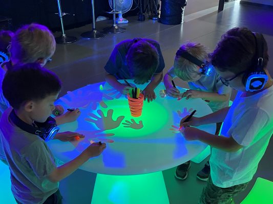Kids doing glow art